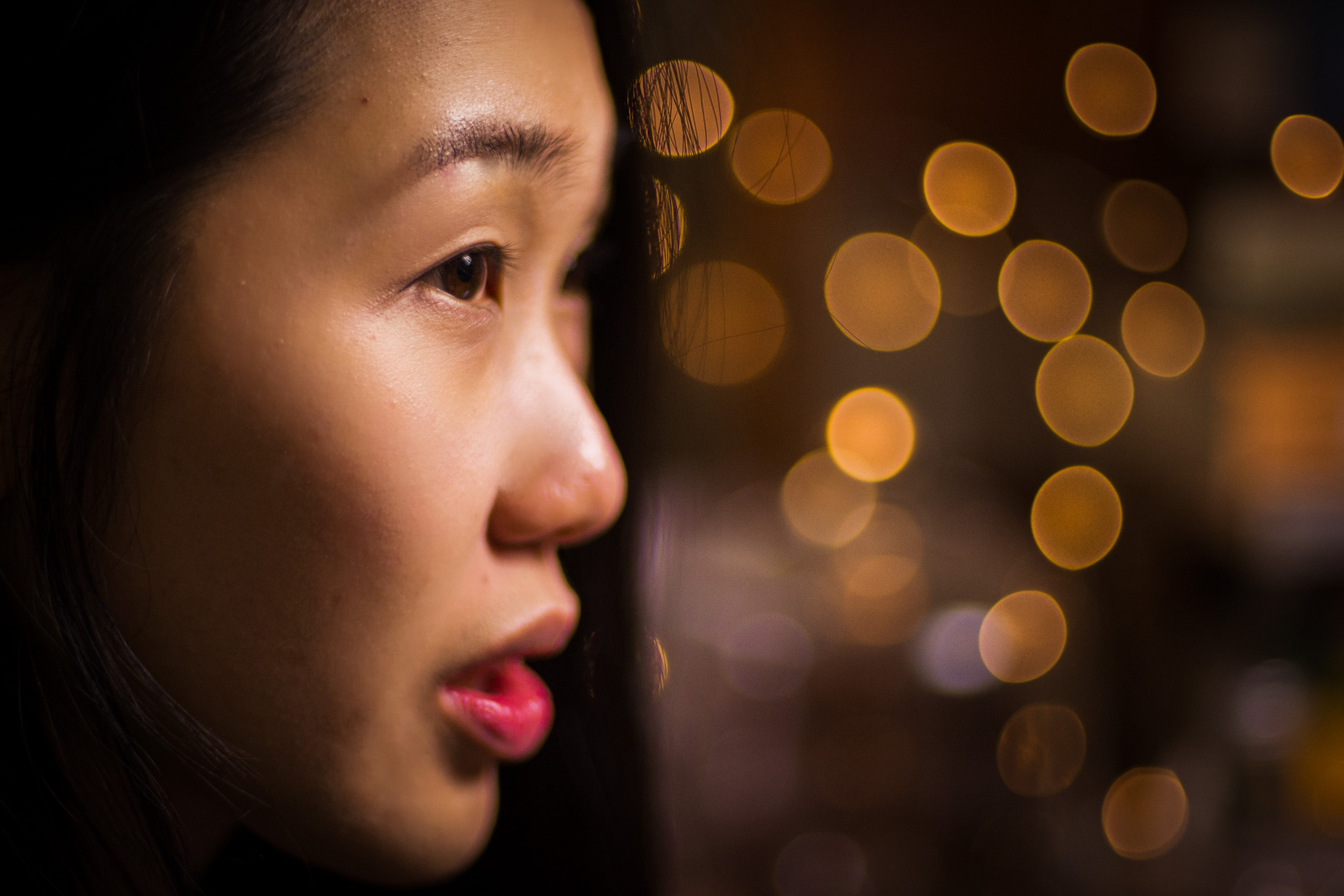 Oanh's sideface photo with sparkly eyes
